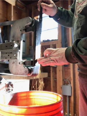 Surface grinding a chef knife as part of the knife making process